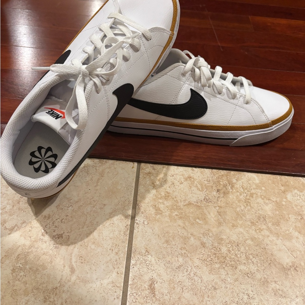 Nike Men's White and Black Sneakers with Gold Accents